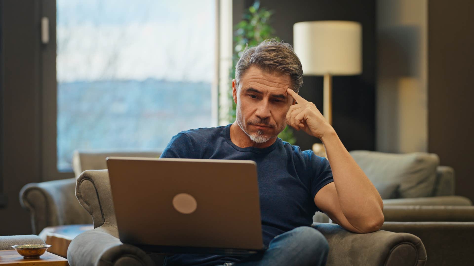 inefficient man being lazy on computer